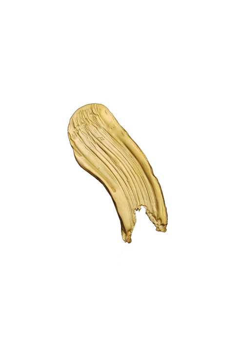 Handcrafted gold brooch looking like a paint stroke on a white background