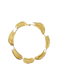 Handcrafted gold necklace looking like paint strokes on a white background