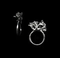 handcrafted silver rubella ring on black background