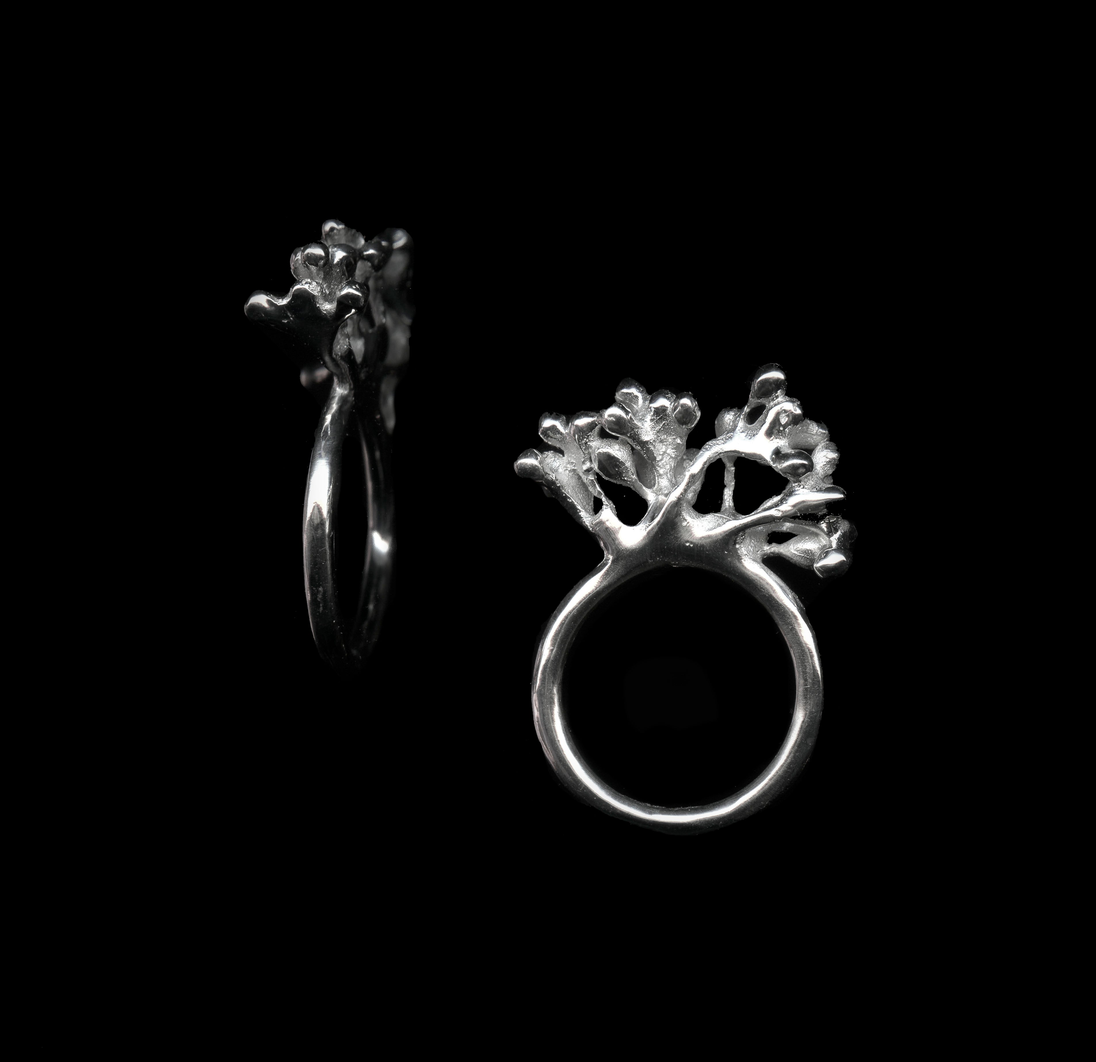 handcrafted silver rubella ring on black background