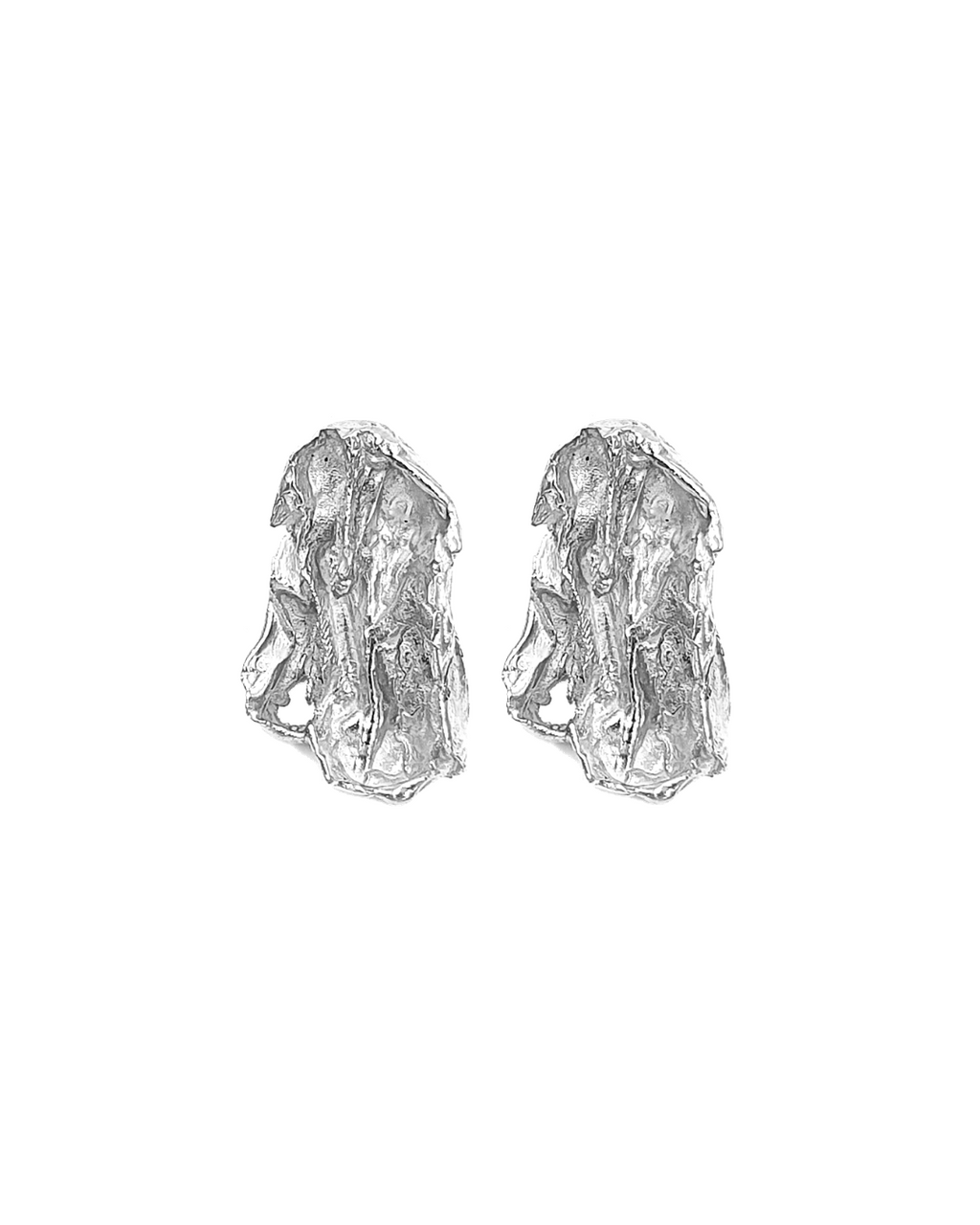 Pair of handcrafted silver earrings on a white background