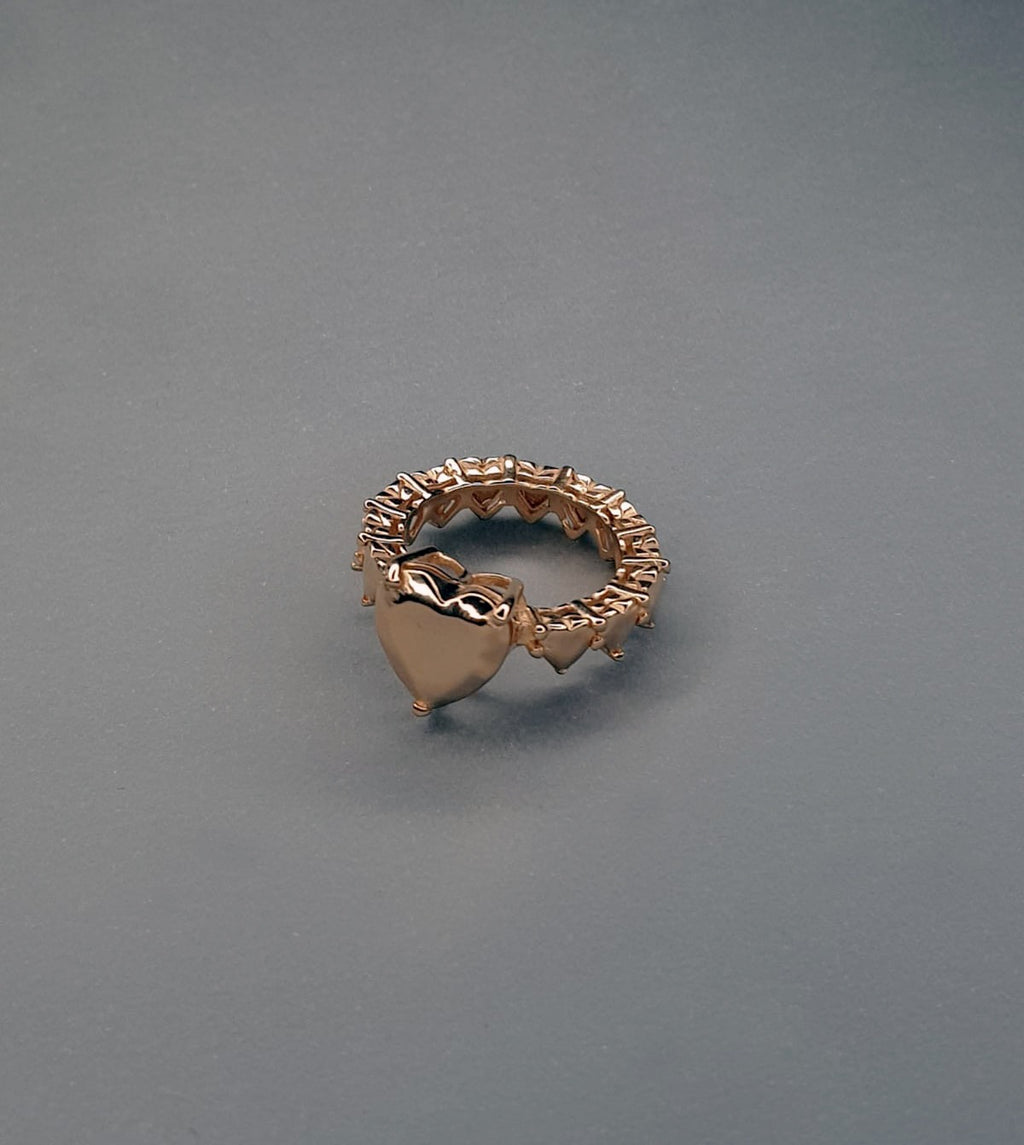 handcrafted rose gold ring on grey background