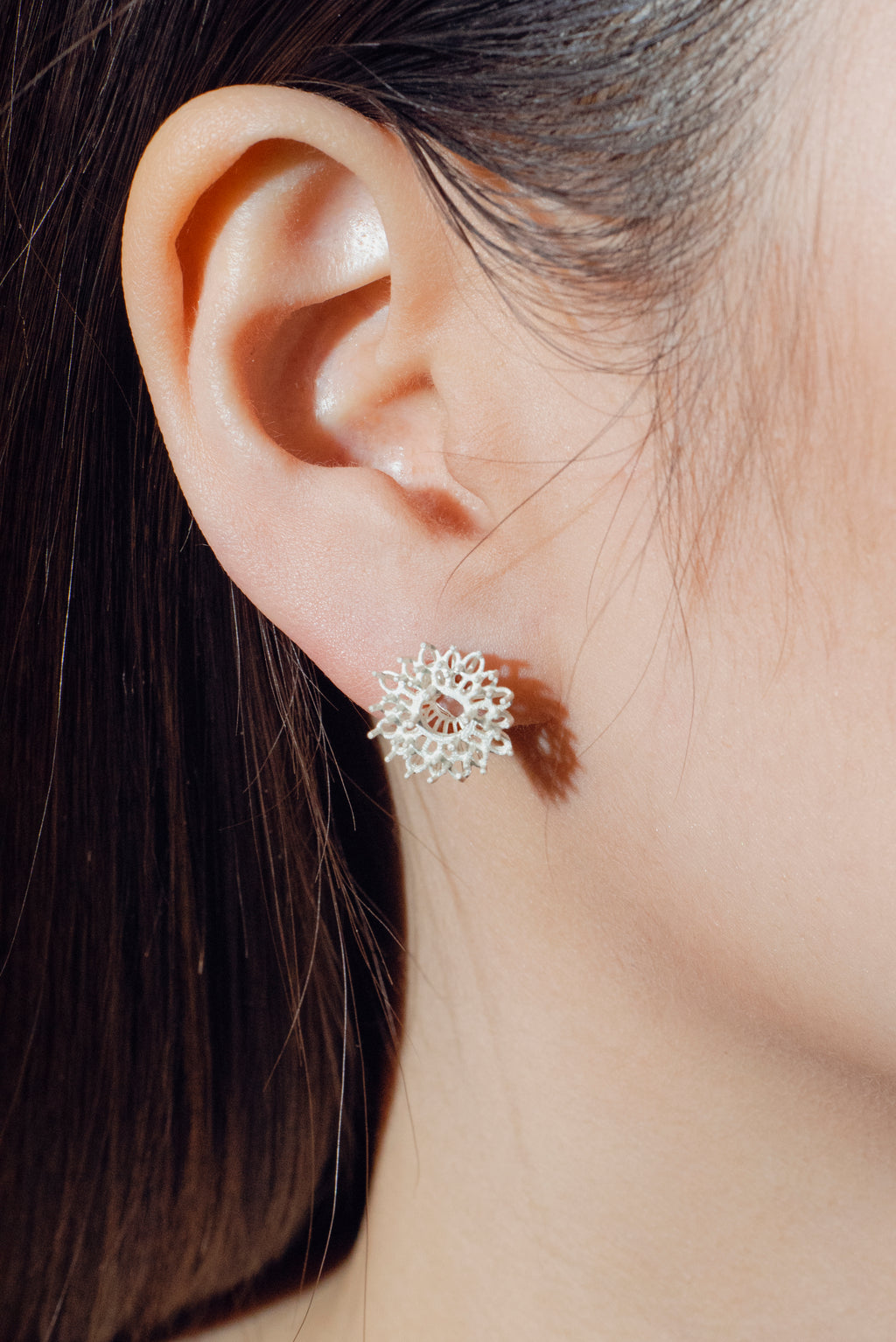 Handcrafted Silver earring worn by model