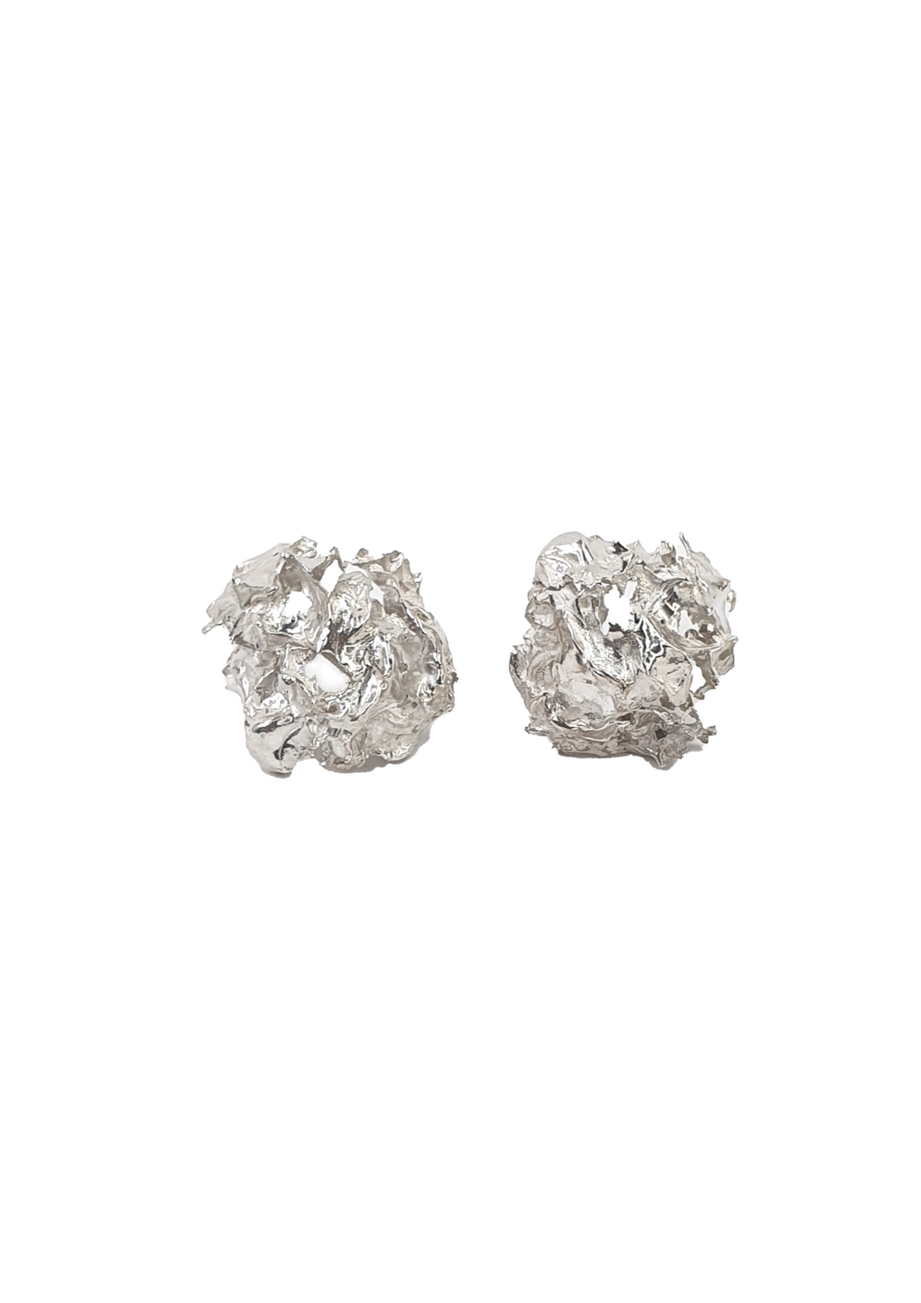 handcrafted silver earrings on white background